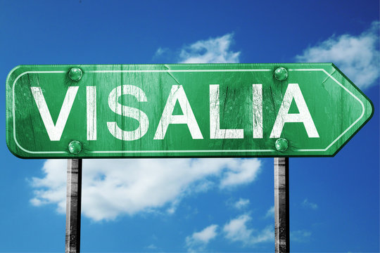 visalia road sign , worn and damaged look