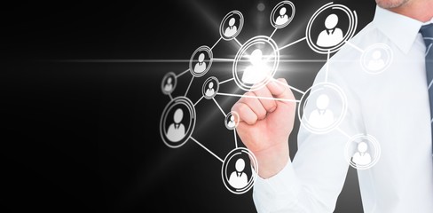 Composite image of businessman pointing with his finger