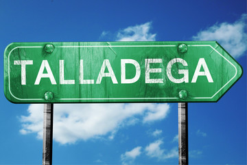 talladega road sign , worn and damaged look