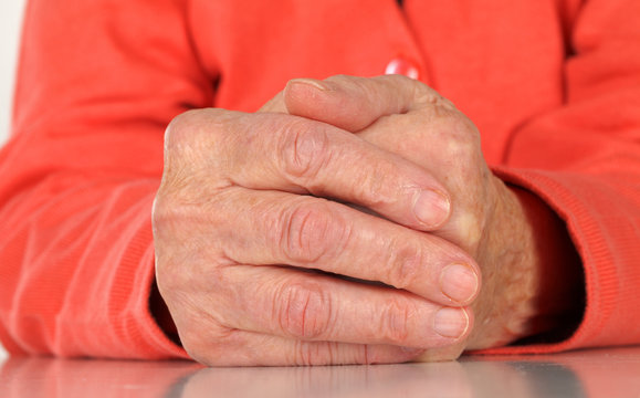 Wrinkled elderly hands