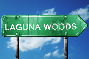 laguna woods road sign , worn and damaged look