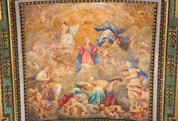 Fototapeta na wymiar Rome - The Coronation of Virgin Mary ceiling fresco by Carlo Saraceni (1611 - 1617) in church Chiesa di Santa Maria in Aquiro in Annunciation chapel.