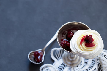 Meringue dessert with cream cheese and cherry jam