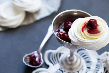 Meringue dessert with cream cheese and cherry jam