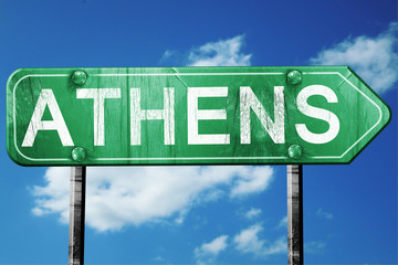 athens road sign , worn and damaged look