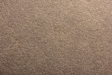 Distressed grainy golden shine background.