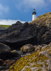 Fototapeta na wymiar Lighthouse Above Rocks