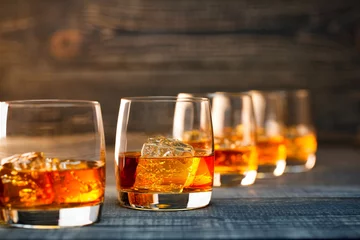 Zelfklevend Fotobehang Alcohol Glass of cold whiskey
