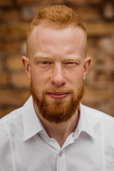 Fototapeta premium portrait of young red hair man with beard