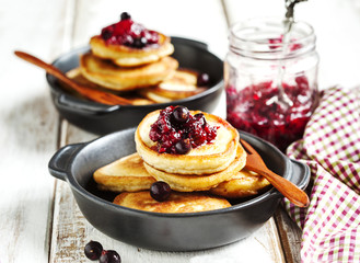 Stack of pancakes with blackcarrent jam
