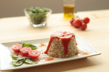 Cuban style rice on a white plate elongated