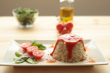 Cuban style rice on a white plate elongated