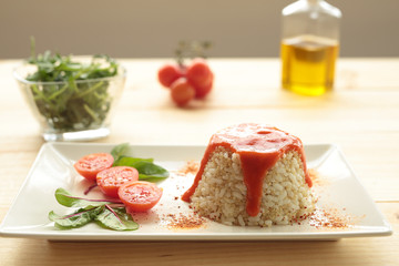 Cuban style rice on a white plate elongated