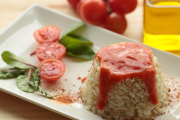 Cuban style rice on a white plate elongated