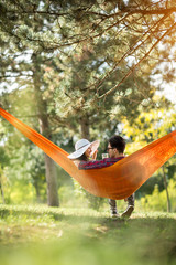 Couple in hammock photographed from behind