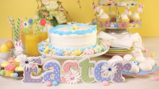 Dessert table set with cake and cupcakes for Easter brunch