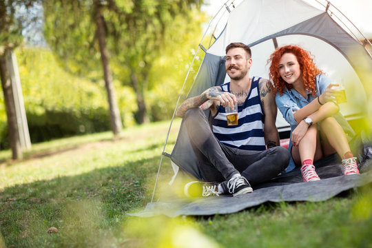 Young couple at summer camping