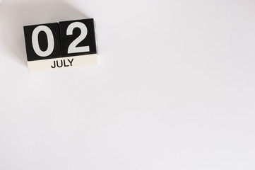 July 2nd. Image of july 2 wooden color calendar on white background. Summer day. Empty space for text. World Sports Journalists Day. UFO DAY