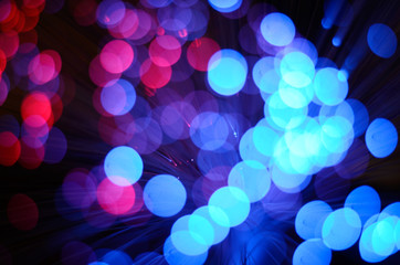 Blurred abstract pink and blue bokeh lights. Christmas holiday defocused background