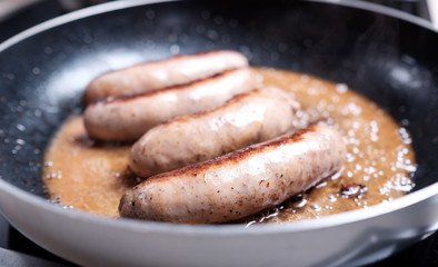 Sausages cooking