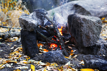 Man making fire in mountains
