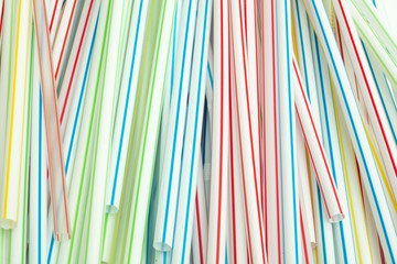 Detail of group of colorful drinking straws