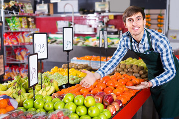 young man offering fruits