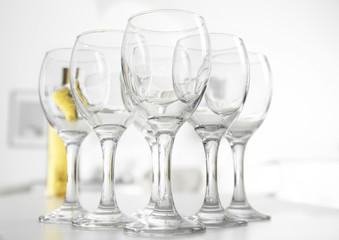 Wineglasses on blurred interior background