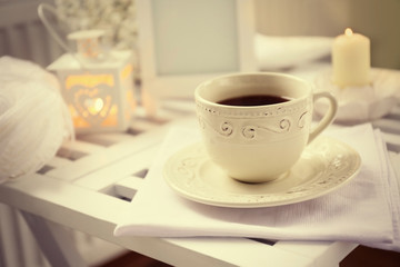 Cup of tea on coffee table in the room, close up