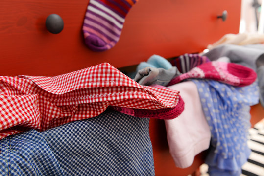 Pile of clothes in open drawer, close up