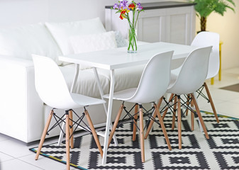 Beautiful comfortable modern interior with table and chairs