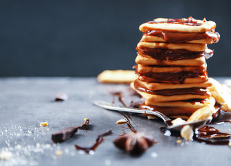 Tasty cookies with chocolate on dark background, close up