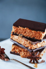 Tasty homemade cakes with chocolate on dark background, close up