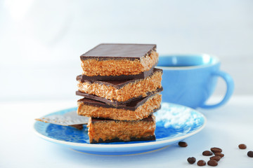 Tasty homemade cakes with chocolate on light background