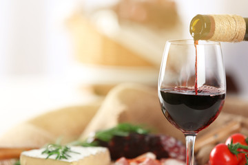 Glass of wine with food on table closeup