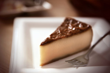 Tasty cheesecake on table in cafe or restaurant