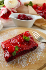 Cherry strudel with mint on cutting board