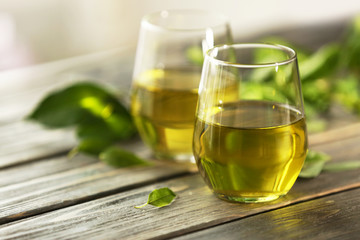 Cups of tea on wooden table
