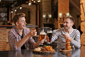 Two friends spending time in bar