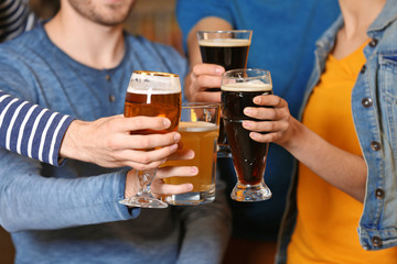 Group of young people spending time in bar