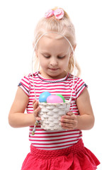 Little girl holding basket with Easter eggs isolated on white