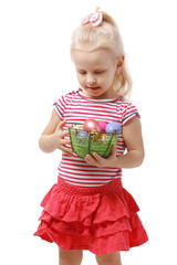 Little girl holding basket with Easter eggs isolated on white