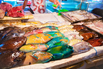 Different kinds of fish for sale at fish market in Asia