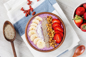 Chia pudding, acai berry smoothie bowl with fruits and homemade muesli