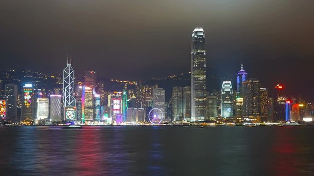 Light show in Hong Kong at night. Victoria Harbour and Hong Kong Central. Zoom timelapse
