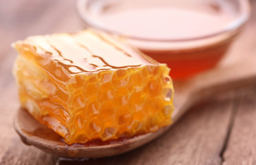 Honeycomb in a wooden spoon