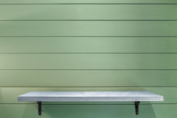 empty wooden shelf on vintage plank wallpaper