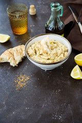 Hummus with olive oil, spices and pitta bread 
