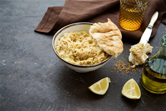 Hummus With Olive Oil, Spices And Pitta Bread 
