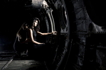 girls in ruined airplane